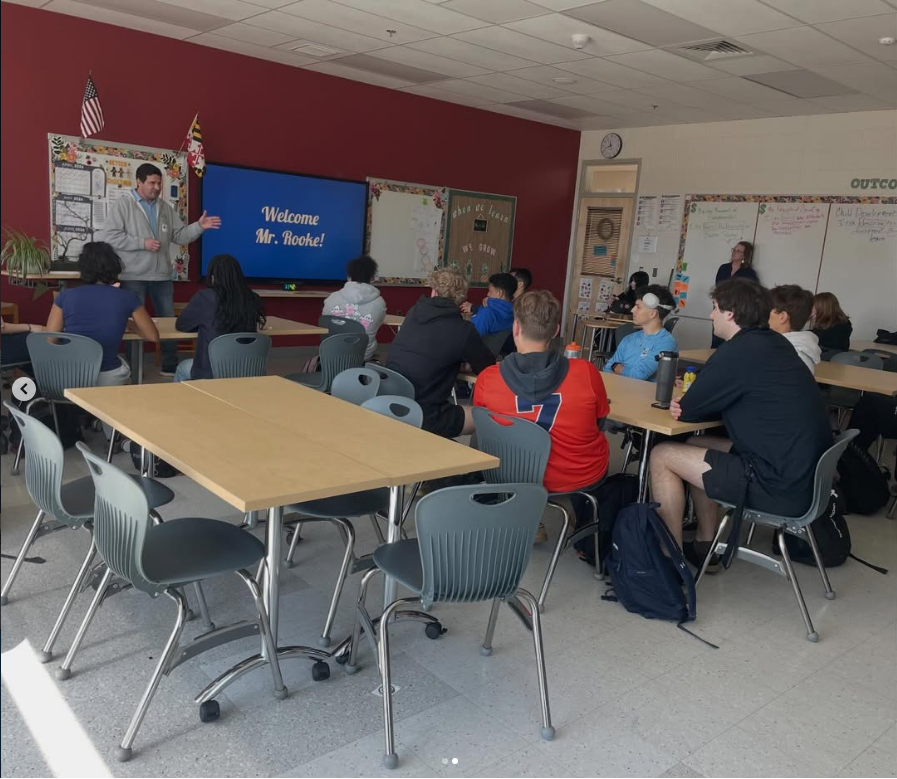MBHS members meeting with a guest speaker in a Maryland high school classroom
